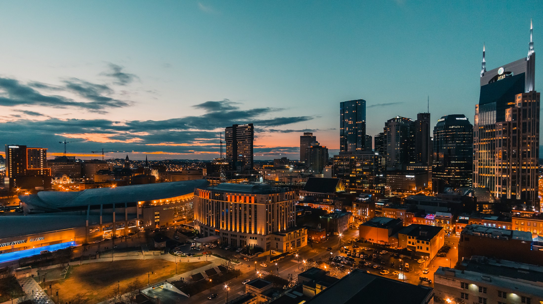 Nashville’s downtown skyline and illuminated streets at dusk.